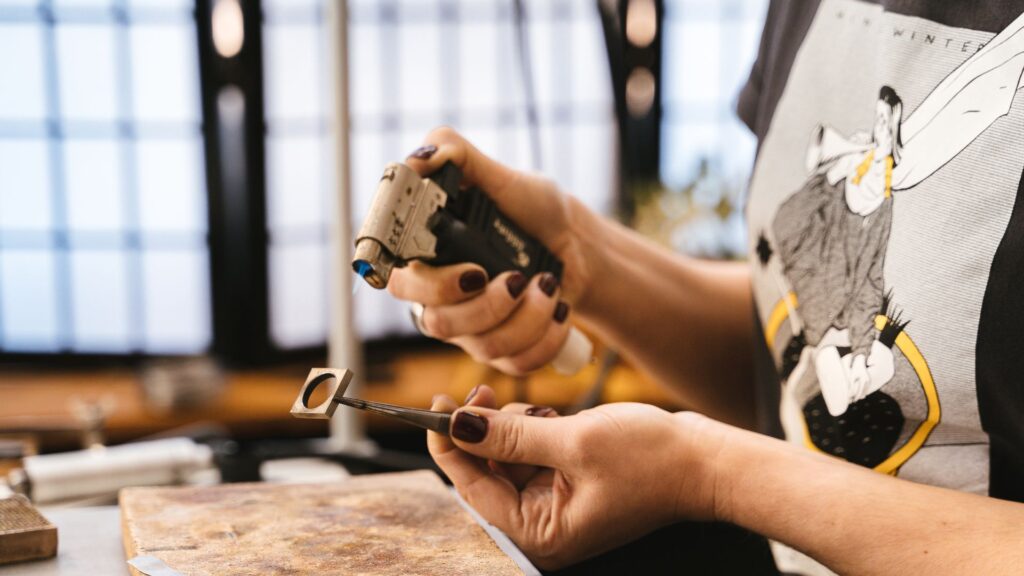 Shot of a goldsmithing working with a blow torch