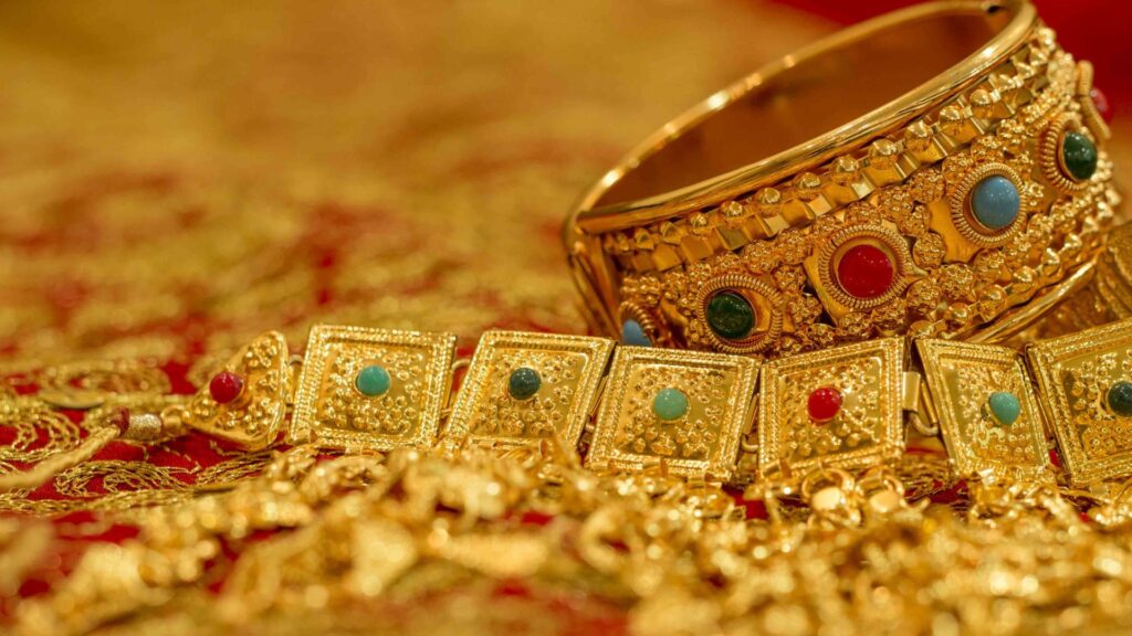 Shot of gold jewelry with gemstones, indian design