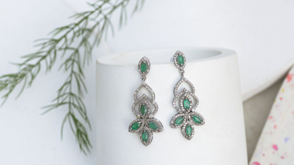 Shot of a finished pair of earrings, presumably made from white gold