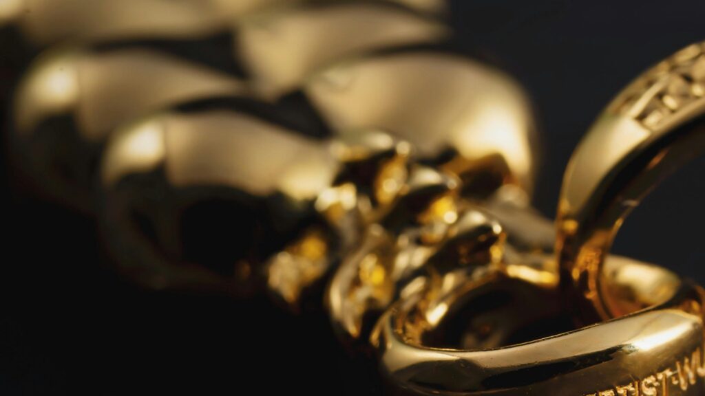 Golden jewelry on black background